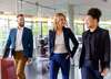 3 person walking together in an office