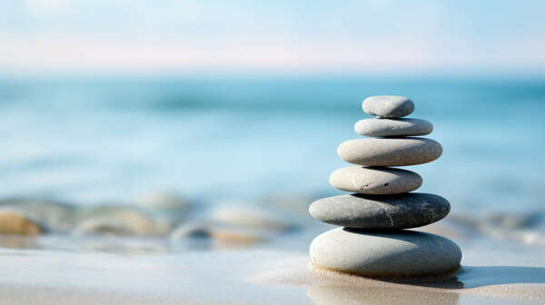 zen stones stack balancing on the beach