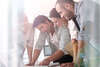 4 people collaborating around a table
